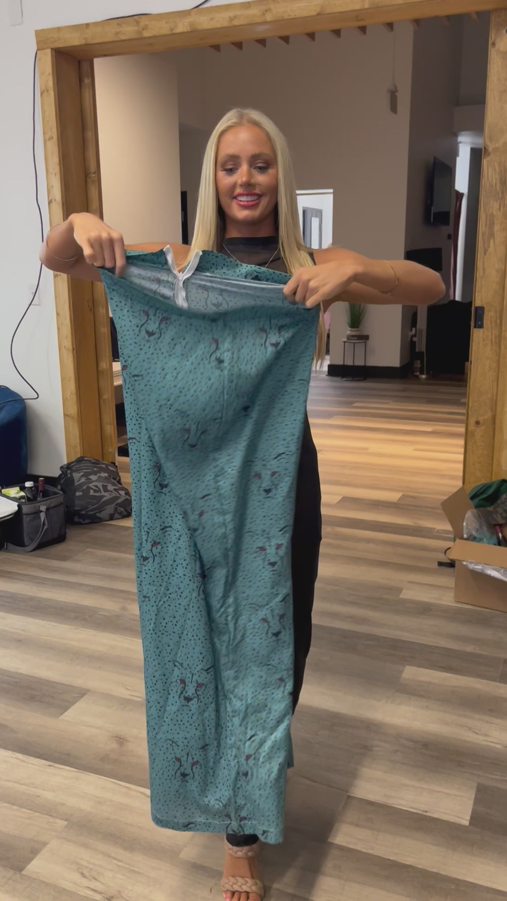 Model reviewing the pants she just tried on